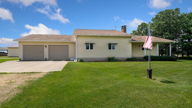 10245 W Penn Cor, Polo, IL 61064 - view of front of property with a garage, driveway, a chimney, and a front lawn