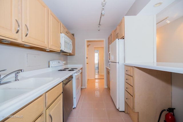 3900 N Lake Shore Dr Unit 3E, Chicago, IL 60613 - kitchen featuring white appliances, light brown cabinetry, light countertops, rail lighting, and light tile patterned flooring