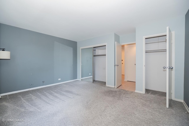 3900 N Lake Shore Dr Unit 3E, Chicago, IL 60613 - unfurnished bedroom featuring multiple closets and carpet