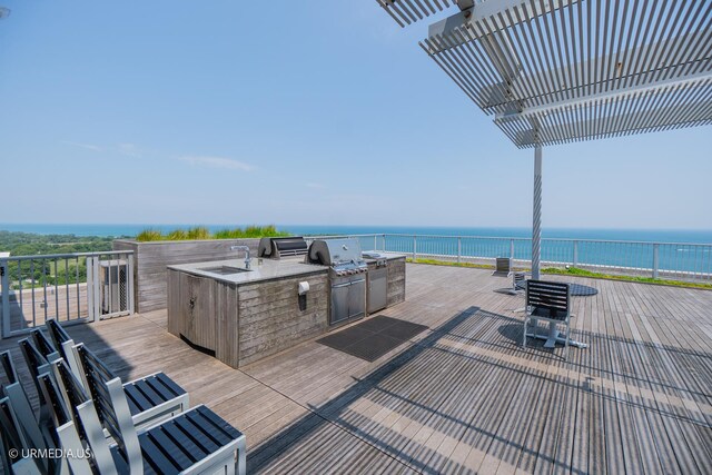 3900 N Lake Shore Dr Unit 3E, Chicago, IL 60613 - wooden deck with exterior kitchen and a water view