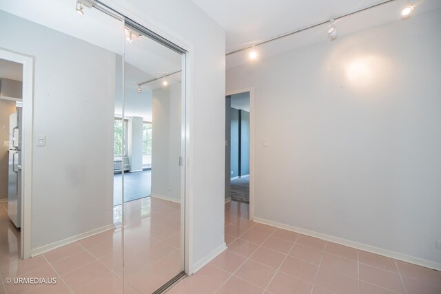3900 N Lake Shore Dr Unit 3E, Chicago, IL 60613 - hall with rail lighting and light tile patterned floors