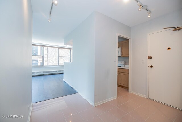 3900 N Lake Shore Dr Unit 3E, Chicago, IL 60613 - hall with track lighting, baseboard heating, and light tile patterned floors
