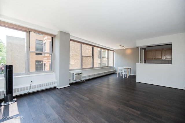 3900 N Lake Shore Dr Unit 3E, Chicago, IL 60613 - unfurnished living room featuring dark wood finished floors, radiator heating unit, and a wall mounted AC