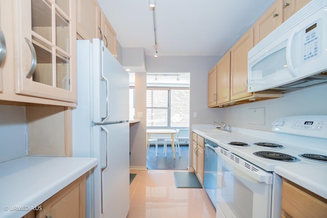 3900 N Lake Shore Dr Unit 3E, Chicago, IL 60613 - kitchen featuring white appliances, light brown cabinetry, light countertops, glass insert cabinets, and rail lighting