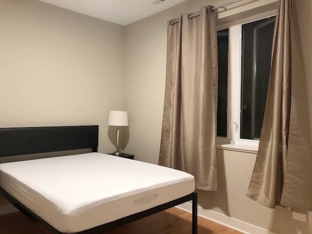 1017 S Claremont Ave, Chicago, IL 60612 - bedroom with baseboards and wood finished floors