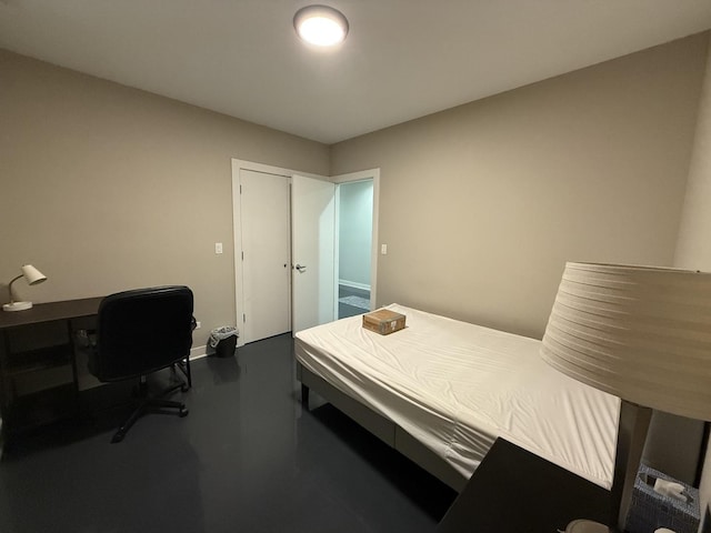 1017 S Claremont Ave, Chicago, IL 60612 - bedroom featuring finished concrete flooring, a desk, and a closet