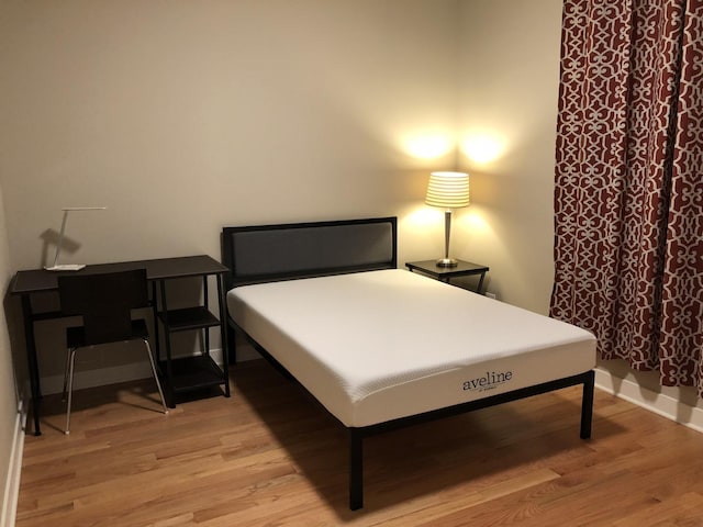 1017 S Claremont Ave, Chicago, IL 60612 - bedroom featuring light wood-style flooring