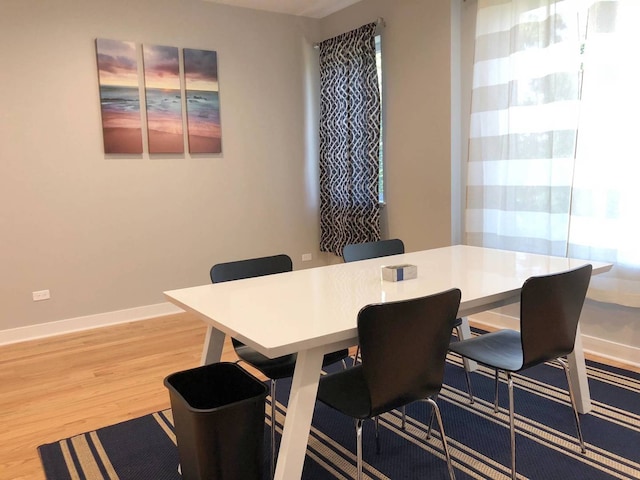 1017 S Claremont Ave, Chicago, IL 60612 - dining area featuring light wood-style flooring and baseboards