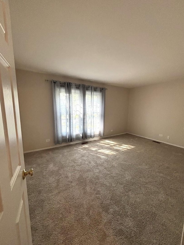 2S561 Ashley Dr, Glen Ellyn, IL 60137 - carpeted spare room with baseboards