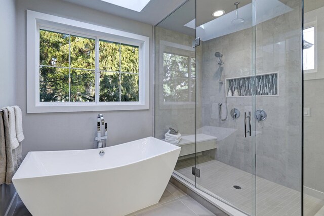 10502 Henning Dr, Huntley, IL 60142 - full bathroom with a freestanding tub, a shower stall, and tile patterned floors