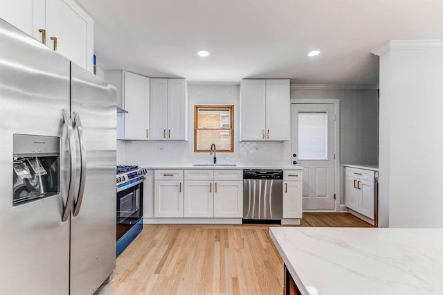 1441 Forest Rd, La Grange Park, IL 60526 - kitchen featuring stainless steel appliances, crown molding, white cabinetry, light wood-style floors, and recessed lighting
