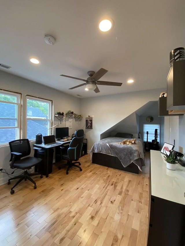 2142 N 73rd Ct, Elmwood Park, IL 60707 - bedroom with an office area, light wood-style flooring, recessed lighting, and ceiling fan