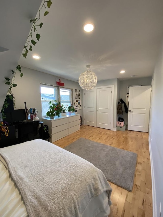 2142 N 73rd Ct, Elmwood Park, IL 60707 - bedroom featuring a chandelier, recessed lighting, and light wood-type flooring