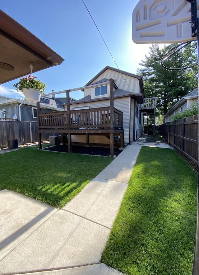 2142 N 73rd Ct, Elmwood Park, IL 60707 - rear view of property featuring a fenced backyard and a deck