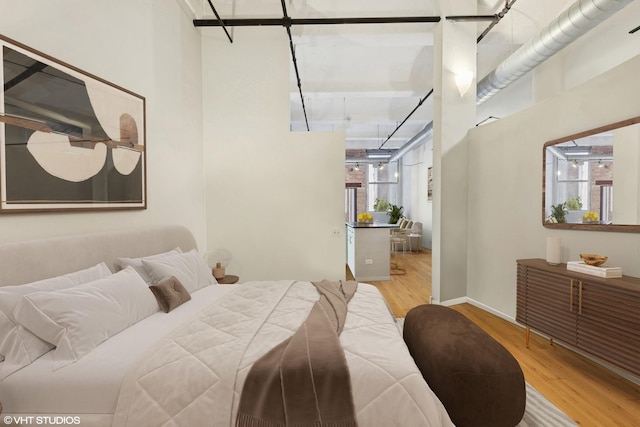 1000 W Washington Blvd Unit 320, Chicago, IL 60607 - bedroom featuring wood finished floors and a towering ceiling