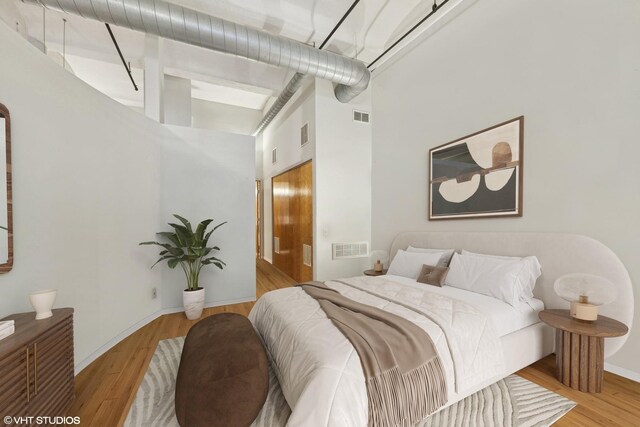 1000 W Washington Blvd Unit 320, Chicago, IL 60607 - bedroom featuring wood finished floors and a high ceiling