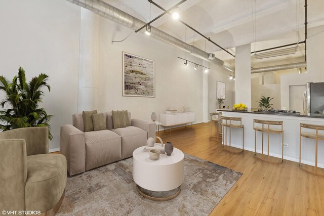 1000 W Washington Blvd Unit 320, Chicago, IL 60607 - living area with wood finished floors and rail lighting