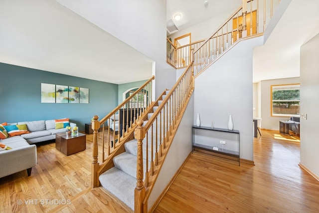 1581 Kenmore Ave, Aurora, IL 60505 - stairway featuring wood finished floors and a towering ceiling