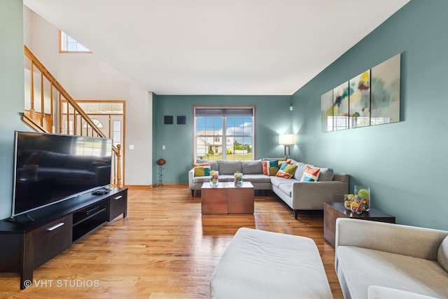 1581 Kenmore Ave, Aurora, IL 60505 - living room featuring healthy amount of natural light, stairs, and light wood-style floors