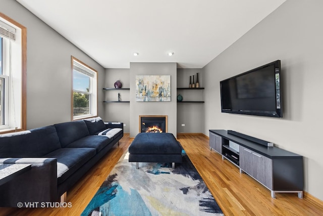1581 Kenmore Ave, Aurora, IL 60505 - living room with light wood-style flooring and a glass covered fireplace