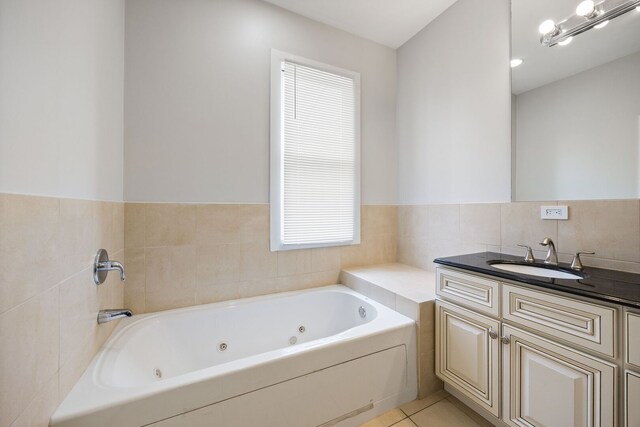 3126 W Walton St Unit 2, Chicago, IL 60622 - bathroom with vanity, a jetted tub, and tile patterned flooring