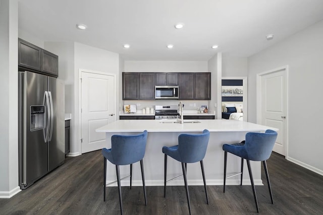 2621 Harnish Dr, Algonquin, IL 60102 - kitchen with stainless steel appliances, dark wood-style floors, a kitchen breakfast bar, and recessed lighting