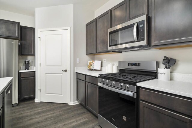 2621 Harnish Dr, Algonquin, IL 60102 - kitchen featuring stainless steel appliances, dark wood-style floors, light countertops, and dark brown cabinetry
