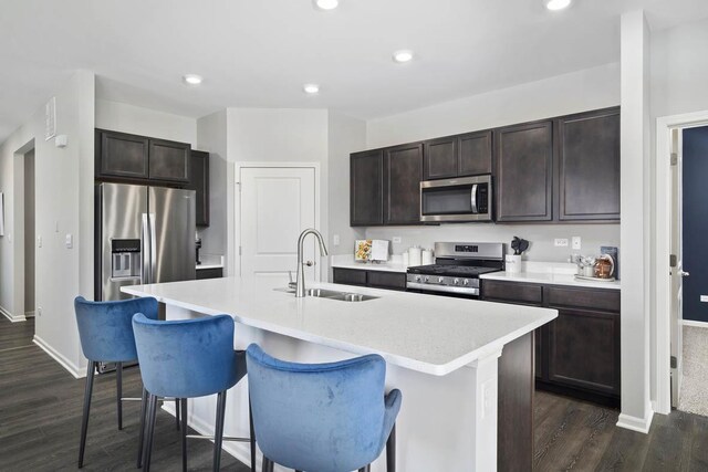 2621 Harnish Dr, Algonquin, IL 60102 - kitchen featuring appliances with stainless steel finishes, dark wood-type flooring, dark brown cabinetry, light countertops, and recessed lighting