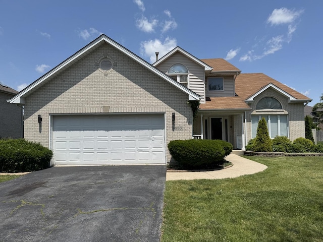 4550 Columbine Ln, Matteson, IL 60443 - traditional-style house with driveway, brick siding, a garage, and a front yard