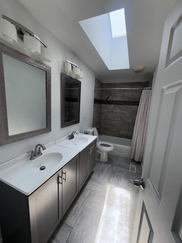 4550 Columbine Ln, Matteson, IL 60443 - bathroom featuring a skylight, double vanity, and shower / tub combo with curtain