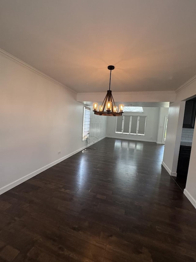 4550 Columbine Ln, Matteson, IL 60443 - unfurnished dining area with a chandelier, ornamental molding, and dark wood-style flooring