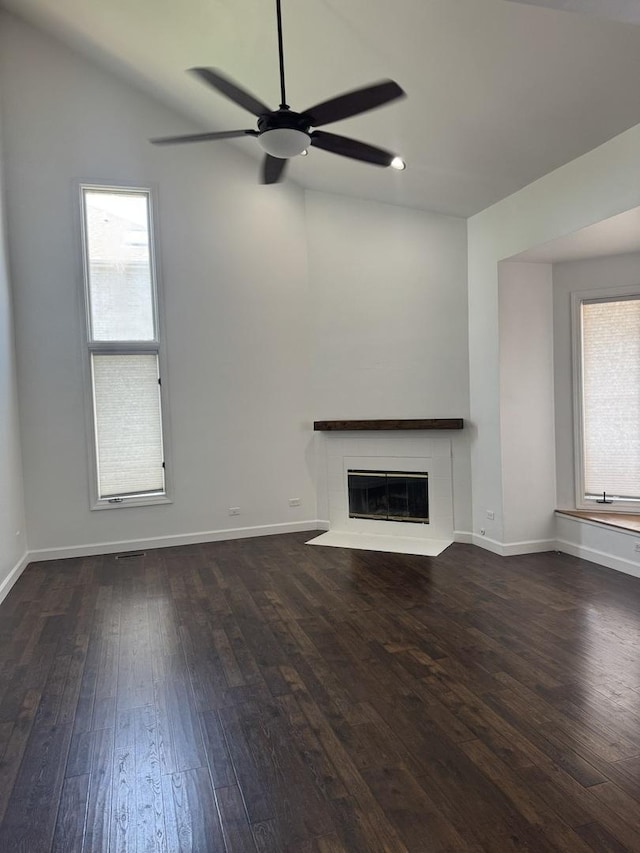4550 Columbine Ln, Matteson, IL 60443 - unfurnished living room featuring a ceiling fan, hardwood / wood-style flooring, a tile fireplace, plenty of natural light, and lofted ceiling