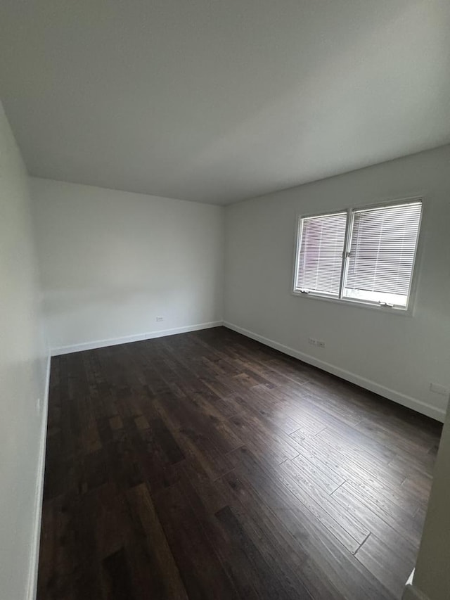 4550 Columbine Ln, Matteson, IL 60443 - unfurnished room featuring dark wood-style floors and baseboards