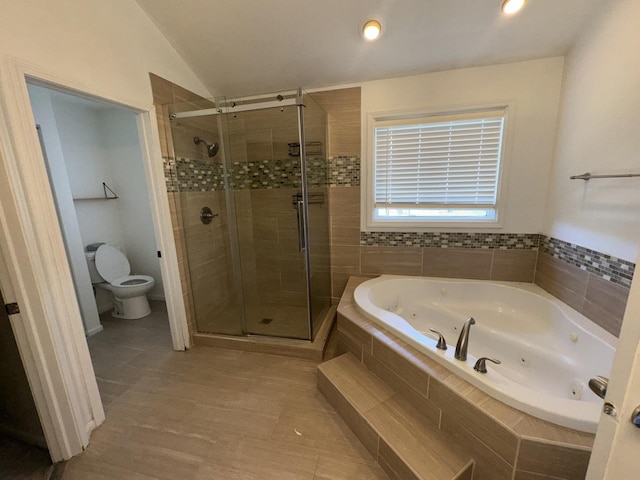 4550 Columbine Ln, Matteson, IL 60443 - bathroom with a tub with jets, a shower stall, and vaulted ceiling