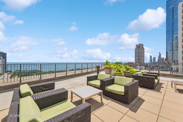 130 N Garland Ct Unit 2612, Chicago, IL 60602 - view of patio with an outdoor living space, a skyline view, and a water view