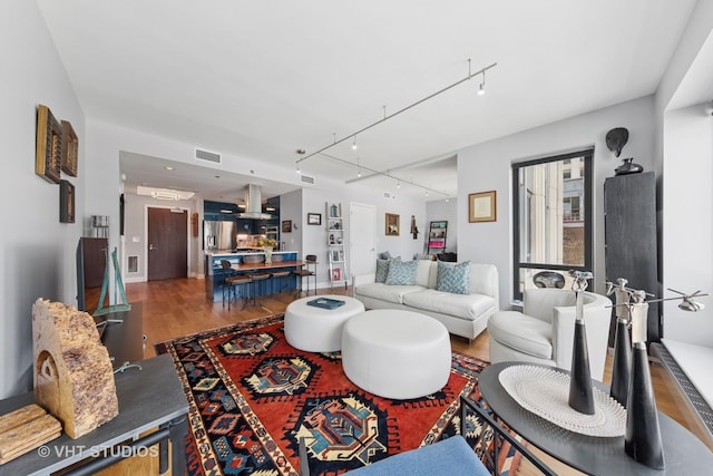 130 N Garland Ct Unit 2612, Chicago, IL 60602 - living area featuring wood finished floors and track lighting