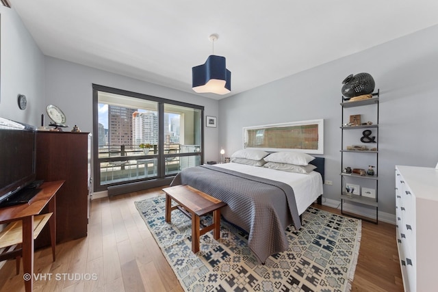 130 N Garland Ct Unit 2612, Chicago, IL 60602 - bedroom featuring light wood-type flooring and access to outside