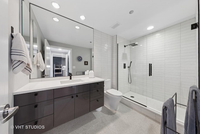 130 N Garland Ct Unit 2612, Chicago, IL 60602 - bathroom featuring vanity, a shower stall, recessed lighting, and tile patterned floors