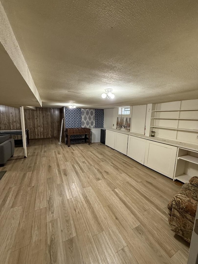 1369 Superior Ave, Calumet City, IL 60409 - below grade area with a textured ceiling and light wood-style floors