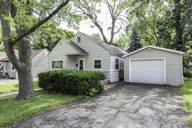 221 Kenwood Dr, Round Lake Park, IL 60073 - view of front facade featuring an outbuilding, a detached garage, and driveway