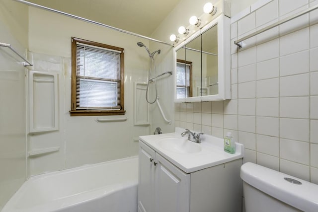 221 Kenwood Dr, Round Lake Park, IL 60073 - full bath featuring shower / bath combination, vanity, tile walls, and backsplash