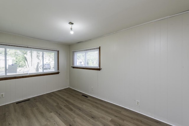 221 Kenwood Dr, Round Lake Park, IL 60073 - spare room featuring dark wood-style floors