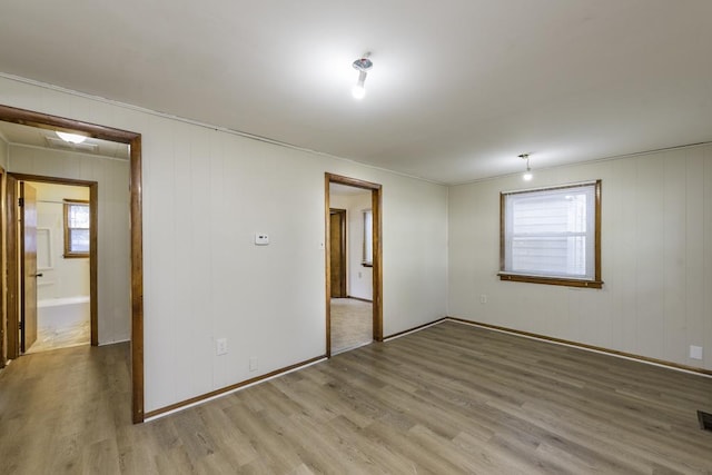 221 Kenwood Dr, Round Lake Park, IL 60073 - spare room with wood finished floors and plenty of natural light