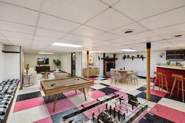 1745 Lyndale Rd, Aurora, IL 60506 - playroom featuring tile patterned floors, a paneled ceiling, and bar area