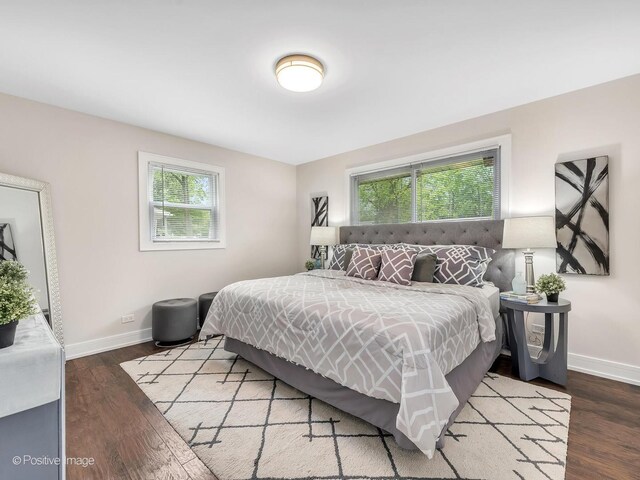 18731 John Ave, Country Club Hills, IL 60478 - bedroom with multiple windows and wood finished floors
