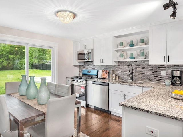 18731 John Ave, Country Club Hills, IL 60478 - kitchen featuring appliances with stainless steel finishes, open shelves, backsplash, and white cabinets