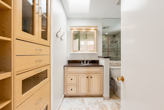 3528 Riverside Dr, Wilmette, IL 60091 - bathroom featuring a skylight, vanity, tiled shower, and marble look tiles