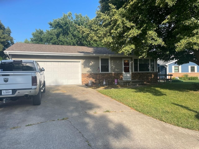 804 N Mohave Dr, Pontiac, IL 61764 - single story home with brick siding, a front lawn, a garage, and driveway