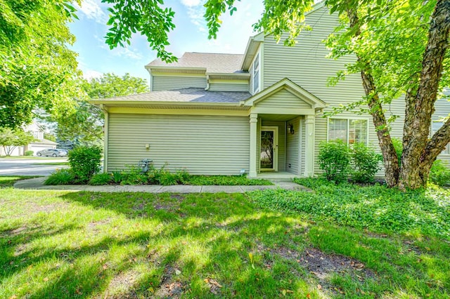 1471 Doolittle Ln, Grayslake, IL 60030 - view of front facade featuring a front yard and a shingled roof