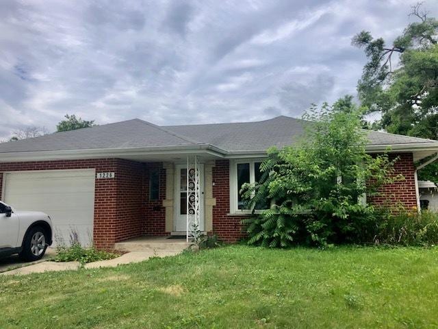 1226 Potter Rd, Park Ridge, IL 60068 - view of front of property with brick siding, an attached garage, and a front lawn